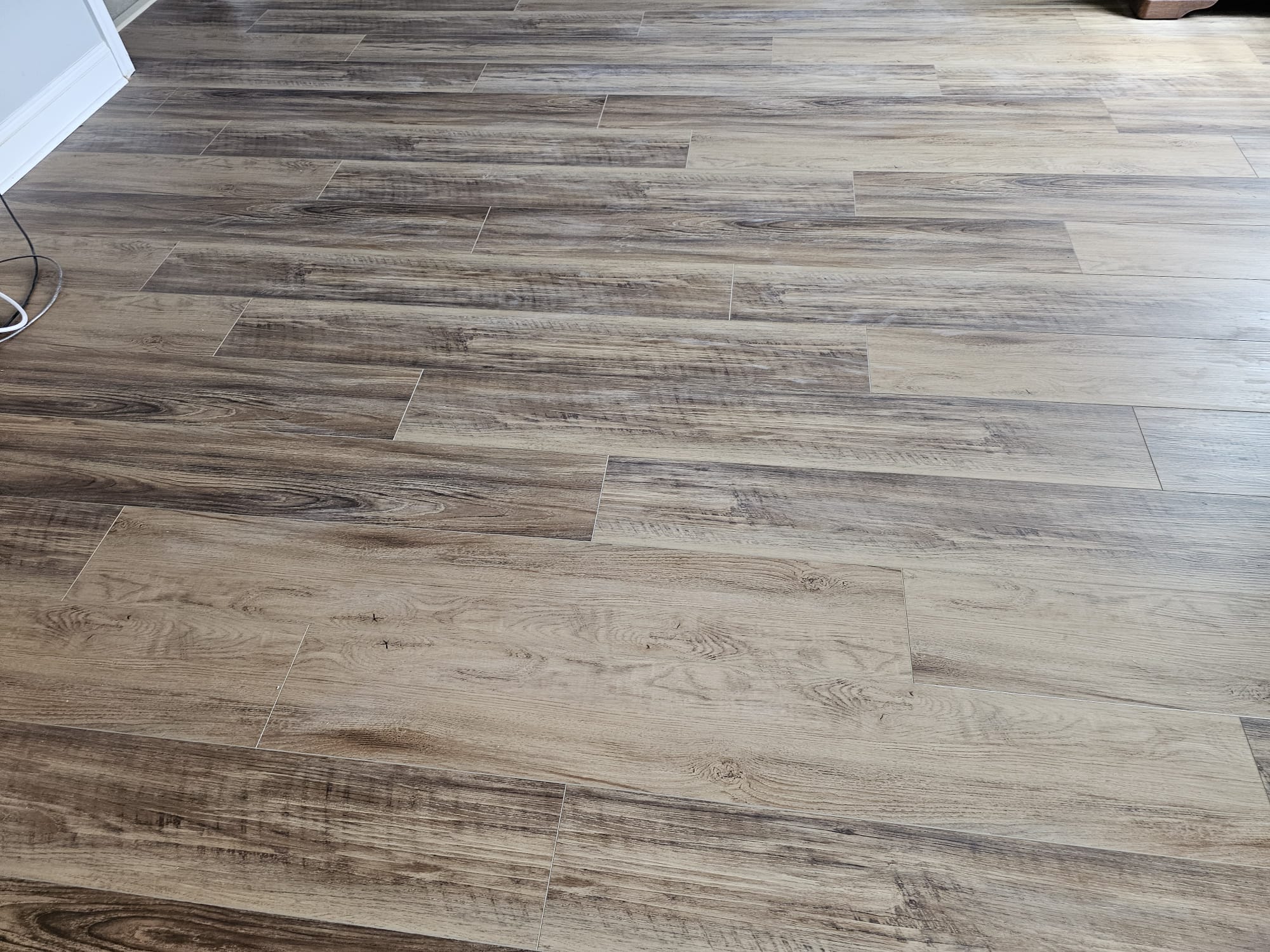 Freshly installed wood-look flooring in a Toms River, NJ home