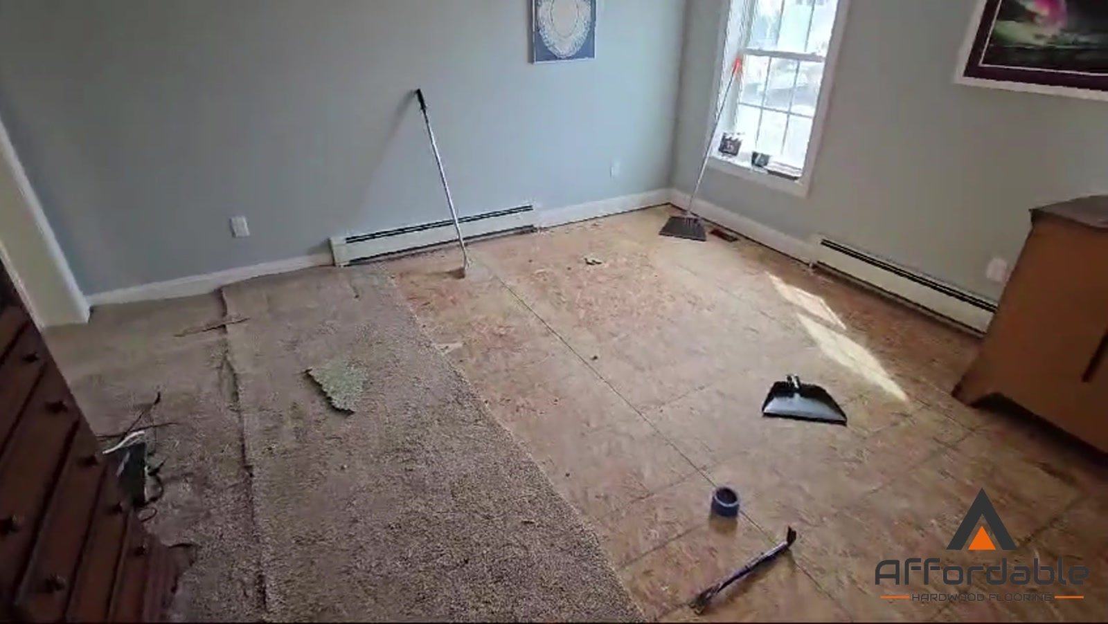 Bedroom stripped down to the bare subfloor before new flooring in Toms River, NJ