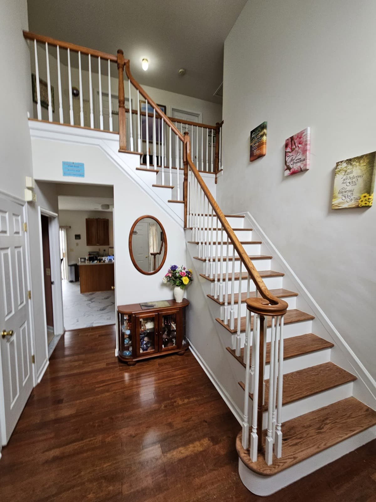 Finished hardwood staircase and entry flooring installed by Affordable Flooring in Ocean County, NJ